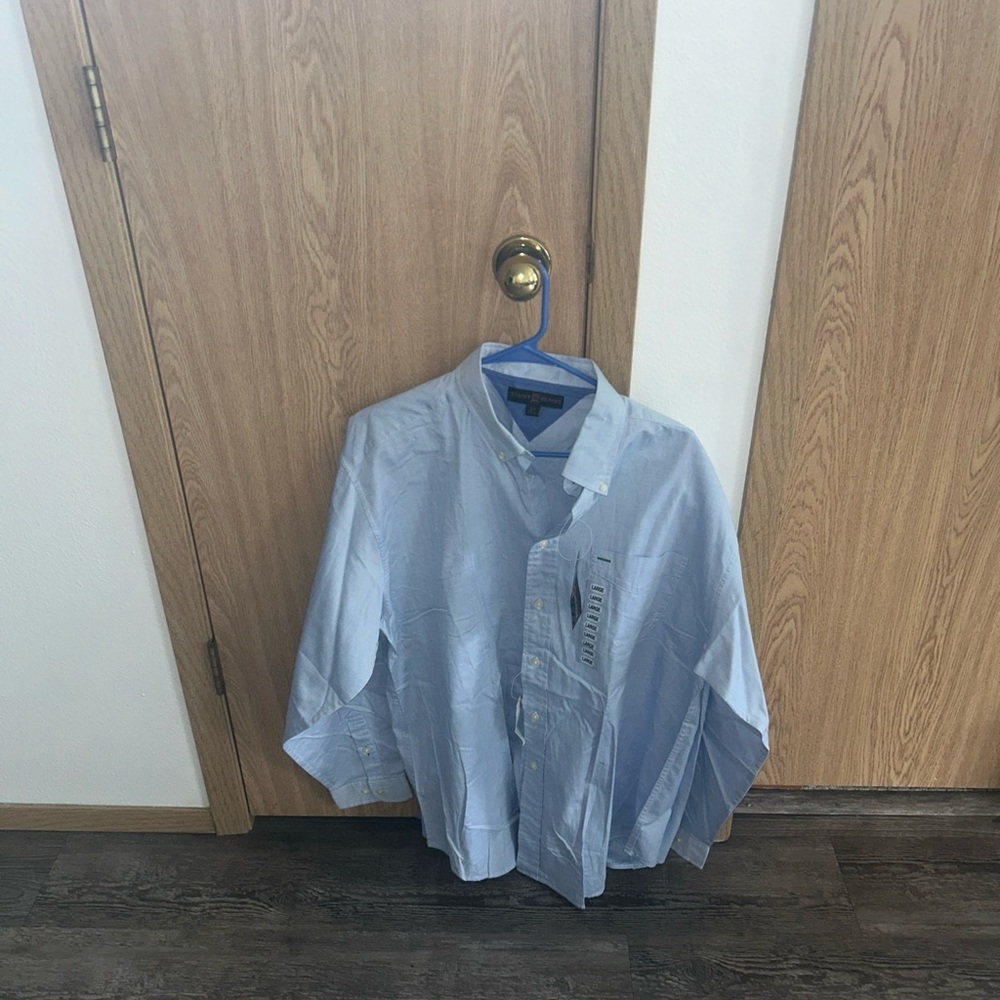 Light blue new with tags, button up dress shirt.